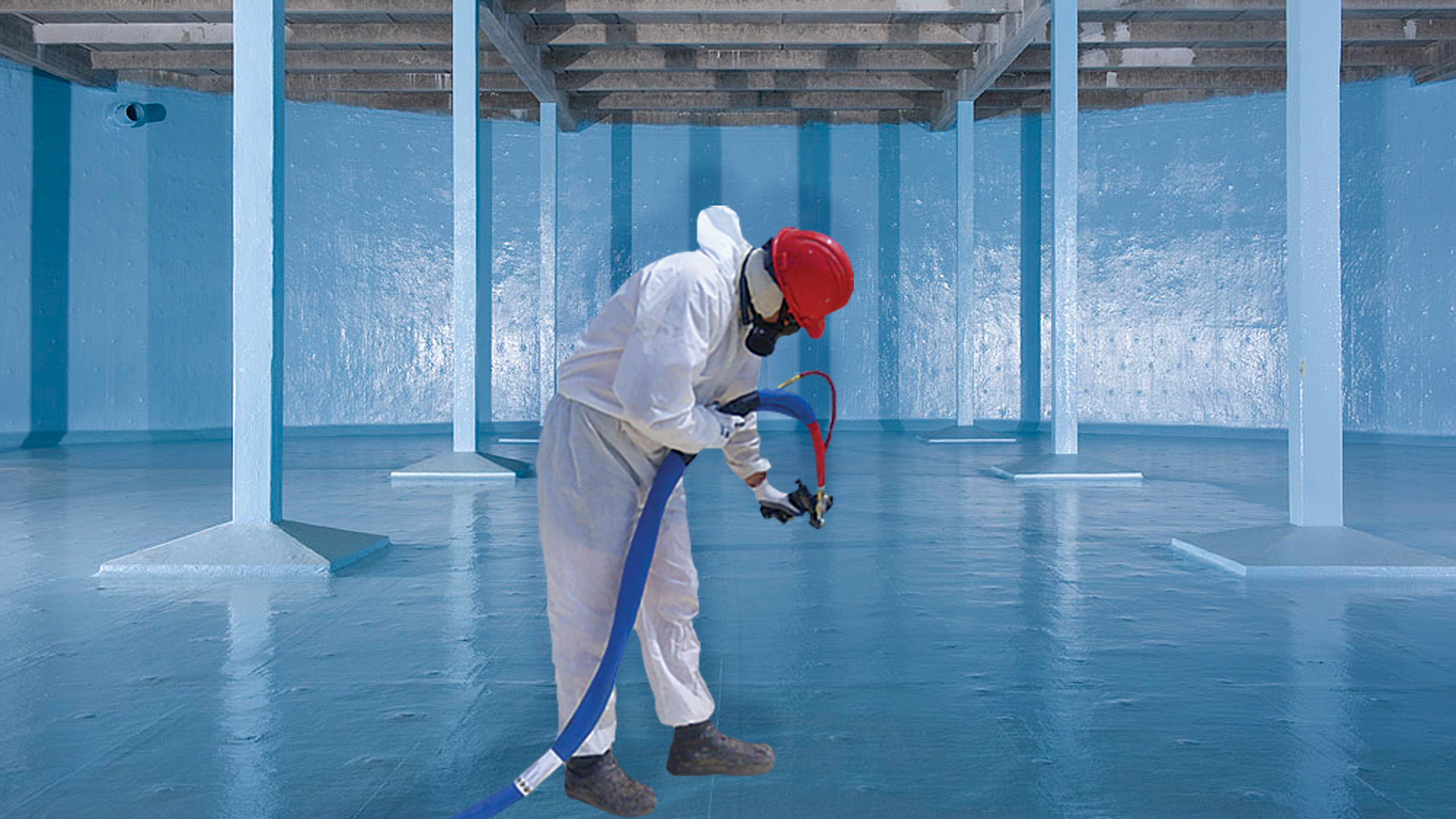 Applicator spraying a polyurea liner inside a water storage tank